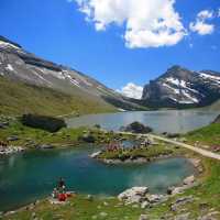 Hikers skirting glacial lakes on the way to Gemmi pass