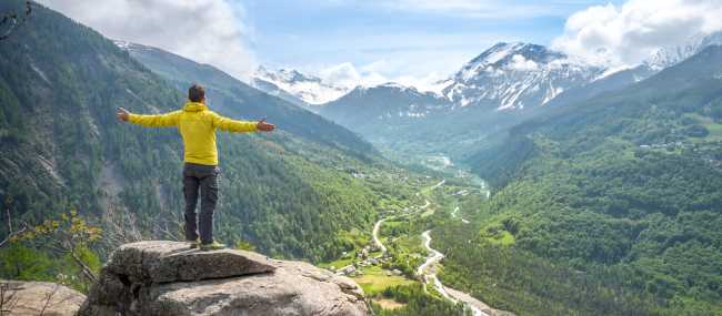 A hiker soaking up the breathtaking landscapes of Écrins National Park | Guillaume Galvani