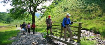 Our group crosses a stream on Wainwright's Coast to Coast walk | John Millen